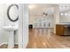 Open floor plan showcasing a sink, living room, and hardwood flooring at 4273 High Park Ln # 15, Atlanta, GA 30344