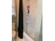 Bathroom with shower-tub combo and black shower curtain next to a window and toilet at 222 Waterford Cove Dr, Suwanee, GA 30024