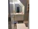 Bathroom with gray walls, sink, storage cabinet, a chair, and a rug at 222 Waterford Cove Dr, Suwanee, GA 30024