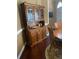 Dining room with wooden hutch adjacent to table, exuding timeless charm with wooden furniture at 222 Waterford Cove Dr, Suwanee, GA 30024