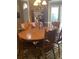 Traditional dining room with wood table, chairs, and a hutch, creating a classic and inviting space at 222 Waterford Cove Dr, Suwanee, GA 30024