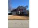 Traditional two-story home with a well-manicured lawn, a two-car garage, and a symmetrical facade at 222 Waterford Cove Dr, Suwanee, GA 30024