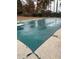 Covered swimming pool area, showcasing the pool cover and surrounding concrete patio at 222 Waterford Cove Dr, Suwanee, GA 30024