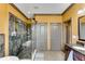 Bathroom featuring a glass-enclosed shower, granite countertop vanity, and tile flooring at 2318 Willington Shoals Se Pl, Smyrna, GA 30080