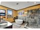 Luxurious bathroom featuring a standalone tub, glass shower, and elegant fixtures for a spa-like experience at 2318 Willington Shoals Se Pl, Smyrna, GA 30080