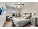 Cozy bedroom with neutral colors, a comfortable queen bed, large window, side table and flat screen television at 2318 Willington Shoals Se Pl, Smyrna, GA 30080