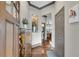 Inviting foyer with hardwood floors, decorative shelving, and modern accents at 2318 Willington Shoals Se Pl, Smyrna, GA 30080