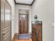 Warm entryway featuring hardwood floors, decor, and gray wainscoting at 2318 Willington Shoals Se Pl, Smyrna, GA 30080