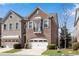 Beautiful brick townhome featuring manicured lawn and attached single car garage at 2318 Willington Shoals Se Pl, Smyrna, GA 30080