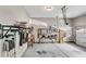 Well-organized garage features wall-mounted storage and ample space for vehicles and projects at 2318 Willington Shoals Se Pl, Smyrna, GA 30080