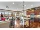 Open kitchen with granite countertops, stainless appliances, and dark wood cabinets at 2318 Willington Shoals Se Pl, Smyrna, GA 30080