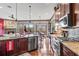 Gourmet kitchen boasts stainless appliances, granite counters, and open layout to the living area at 2318 Willington Shoals Se Pl, Smyrna, GA 30080