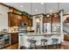 Chef's kitchen with a large island, stainless steel appliances, and custom cabinetry at 2318 Willington Shoals Se Pl, Smyrna, GA 30080