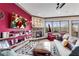 Comfortable living room featuring a fireplace, large windows, and vibrant decor for a modern aesthetic at 2318 Willington Shoals Se Pl, Smyrna, GA 30080