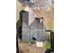 A high-angle aerial view of the home's roof and landscaped yard, shaded by a mature, flowering tree at 3165 Bellestone Ct, Marietta, GA 30066