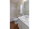 Bathroom with white cabinet, tub and shower, and a sink with chrome faucet at 3165 Bellestone Ct, Marietta, GA 30066