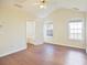 Bright bedroom with vaulted ceiling, ceiling fan, and hardwood flooring at 3165 Bellestone Ct, Marietta, GA 30066