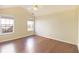 Light-filled bedroom featuring two windows and hardwood flooring at 3165 Bellestone Ct, Marietta, GA 30066