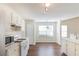 Bright kitchen featuring white cabinets, a breakfast area, and lots of natural light at 3165 Bellestone Ct, Marietta, GA 30066