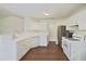 Well-lit kitchen featuring white cabinets, stainless steel appliances, and hardwood floors at 3165 Bellestone Ct, Marietta, GA 30066