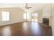 Open living area with wood floors, a corner fireplace, and sliding glass doors to the backyard at 3165 Bellestone Ct, Marietta, GA 30066