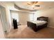 Cozy bedroom with tray ceiling, fan, carpet floors, and windows that provide lots of natural light at 3831 Village Crossing Ln, Ellenwood, GA 30294