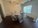 An elegant dining room with hardwood floors, and traditional wainscoting, waiting for the new owners at 3831 Village Crossing Ln, Ellenwood, GA 30294