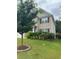 Beautiful two-story house with brick and siding, a lush lawn, and well-maintained landscaping at 3831 Village Crossing Ln, Ellenwood, GA 30294