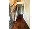 Elegant foyer featuring wood floors, staircase with iron railings, and decorative wall trim at 3831 Village Crossing Ln, Ellenwood, GA 30294