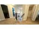 Upstairs hallway with neutral carpet leading to various rooms, including a bedroom and bathroom at 3831 Village Crossing Ln, Ellenwood, GA 30294