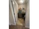 Efficient laundry room with modern washer and dryer set and convenient shelving at 3831 Village Crossing Ln, Ellenwood, GA 30294