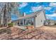Spacious backyard featuring a patio with a porch swing and picturesque wooded views at 1640 Racquet Club Cir, Lawrenceville, GA 30043