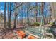 Private backyard patio with a comfortable porch swing and relaxing outdoor seating at 1640 Racquet Club Cir, Lawrenceville, GA 30043
