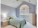 Bedroom with cathedral ceiling, a large window, and a full size bed at 1640 Racquet Club Cir, Lawrenceville, GA 30043