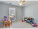Cozy bedroom with window, ceiling fan, and room for play at 1640 Racquet Club Cir, Lawrenceville, GA 30043