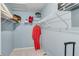 Walk-in closet featuring wire shelving for clothing and storage with a suitcase at 1640 Racquet Club Cir, Lawrenceville, GA 30043