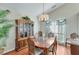 Traditional dining room featuring hardwood floors, large window, and stylish decor at 1640 Racquet Club Cir, Lawrenceville, GA 30043