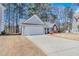 Attractive single-story home with a spacious driveway and well-maintained landscaping at 1640 Racquet Club Cir, Lawrenceville, GA 30043