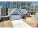 Lovely single-story home with a two-car garage and a mix of siding and brick accents at 1640 Racquet Club Cir, Lawrenceville, GA 30043