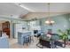 Eat-in kitchen with a breakfast bar, dining table, and plenty of natural light at 1640 Racquet Club Cir, Lawrenceville, GA 30043