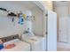 Laundry room with a washer and dryer, with shelving stocked with cleaning supplies at 1640 Racquet Club Cir, Lawrenceville, GA 30043