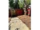 The backyard features a fenced perimeter and pine straw ground cover at 2574 Stratford Ln, Morrow, GA 30260