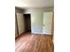 Bedroom with open closet and view of flooring and walls, perfect for comfortable living at 2574 Stratford Ln, Morrow, GA 30260