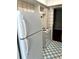 The kitchen features a white refrigerator and stove, and blue and white tiled floors at 2574 Stratford Ln, Morrow, GA 30260