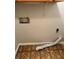 Laundry hookups and vent in the room with printed flooring; ready for appliances at 2574 Stratford Ln, Morrow, GA 30260