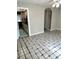 Living room with view to the kitchen and blue and white tiled floor at 2574 Stratford Ln, Morrow, GA 30260