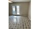 Living room with double doors to the backyard and tiled floors at 2574 Stratford Ln, Morrow, GA 30260
