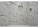 Beautiful bathroom shower features white marble tile and a built-in niche at 4647 Wonder Valley Trl, Decatur, GA 30034