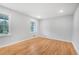 Empty bedroom features hardwood floors and two bright windows at 4647 Wonder Valley Trl, Decatur, GA 30034