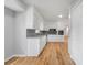 Well-lit kitchen with white cabinets, stainless steel appliances, and granite countertops with backsplash at 4647 Wonder Valley Trl, Decatur, GA 30034